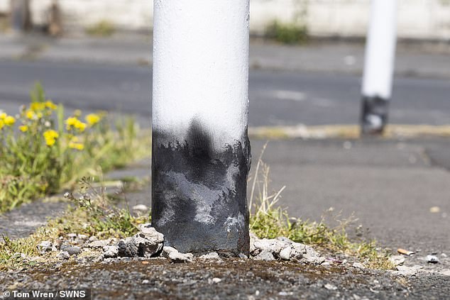 The bottom of the bollard looks like a giant cigarette being put out