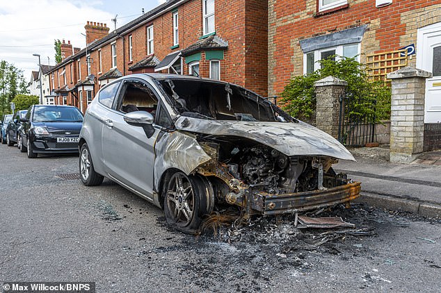 By daylight, the market town resembled a 'war zone' with the burnt-out shells of cars close together