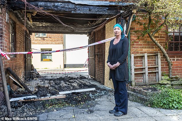 NHS nurse Lisa Dodd ,pictured , 44, was hailed a hero for saving a family at the height of the arson attacks