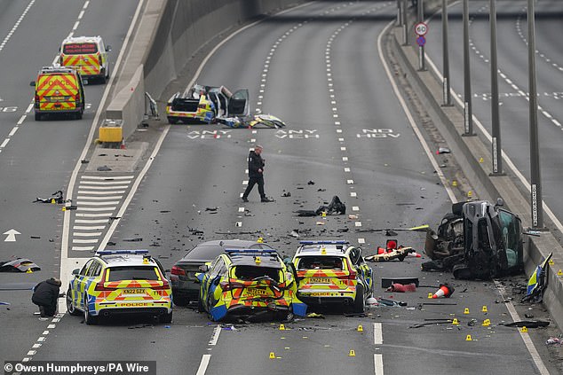 The crash (pictured, the aftermath) involved five police vehicles and a car and saw seven officers injured