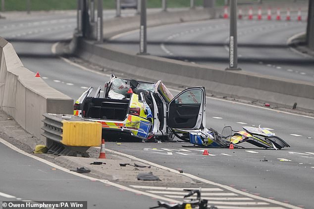 One particularly badly damaged police vehicle (pictured) was almost completely crushed, with several of its doors having fallen off