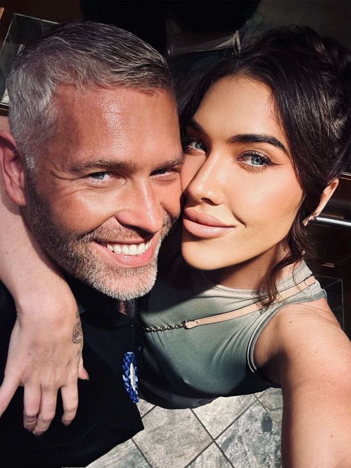 Close-up selfie of Amanda Leigh and Alex Christian embracing.