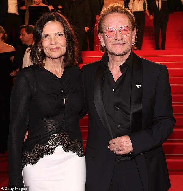 The With or Without you singer suggested in the movie that his wife (left), who he has been married to for 42 years, and best friend David Howell Evans, known as The Edge, were 'an item'