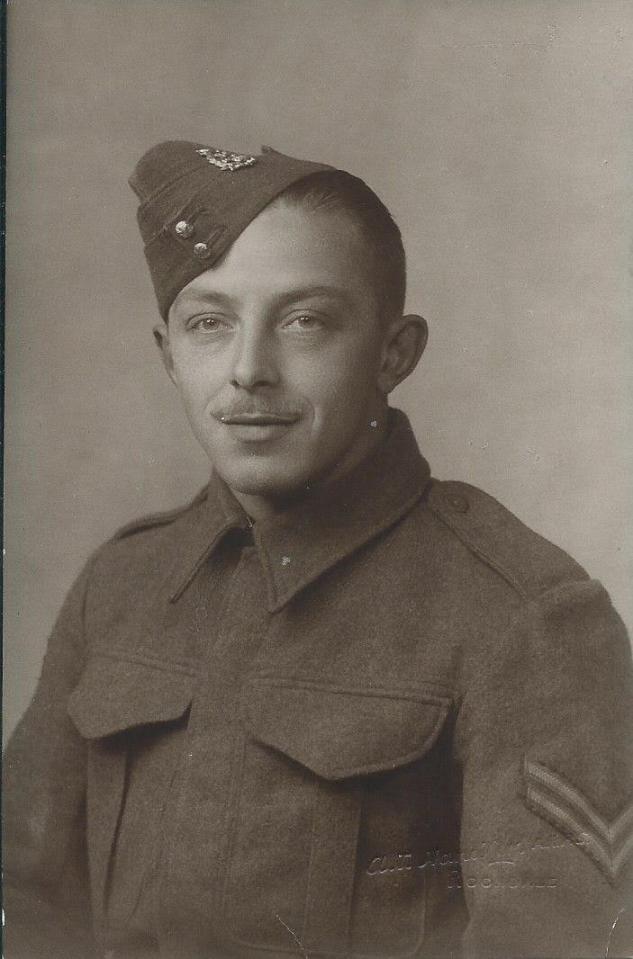 Black and white photo of a young man in a military uniform.