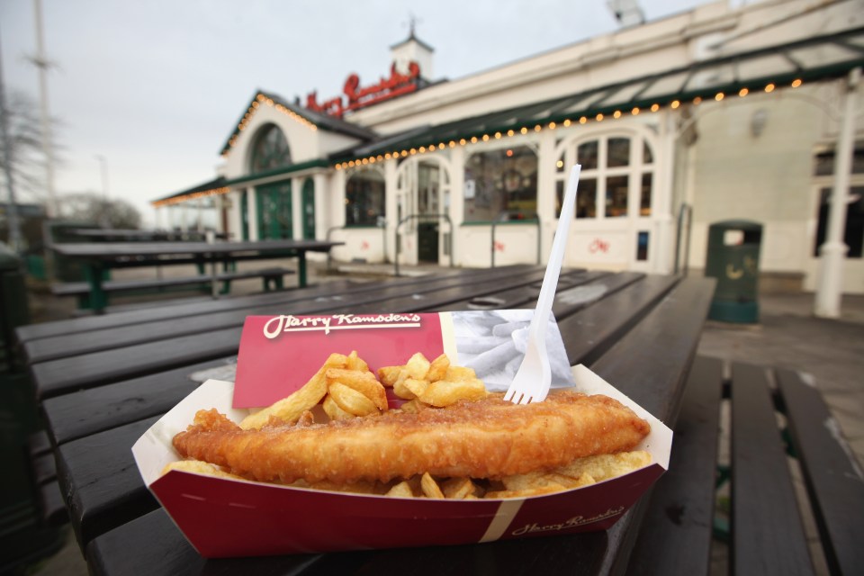Photograph illustration of fish and chips in a takeout container outside Harry Ramsden's.
