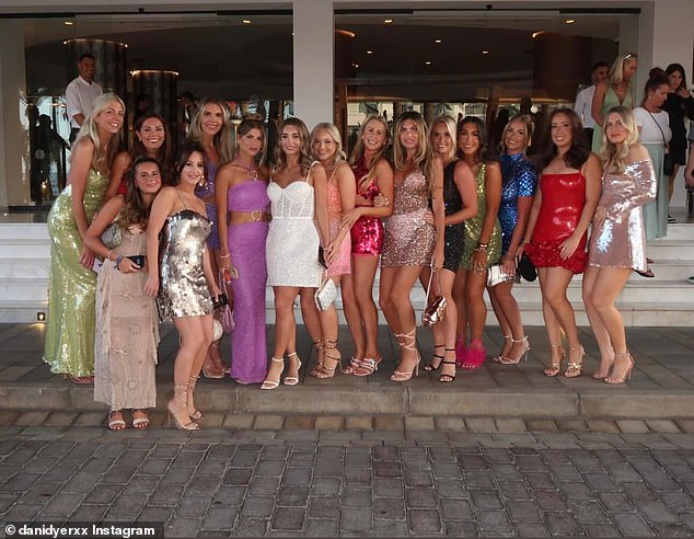 Beaming with joy, she posed for a sweet snap with her glamorous hen party ahead of their night out