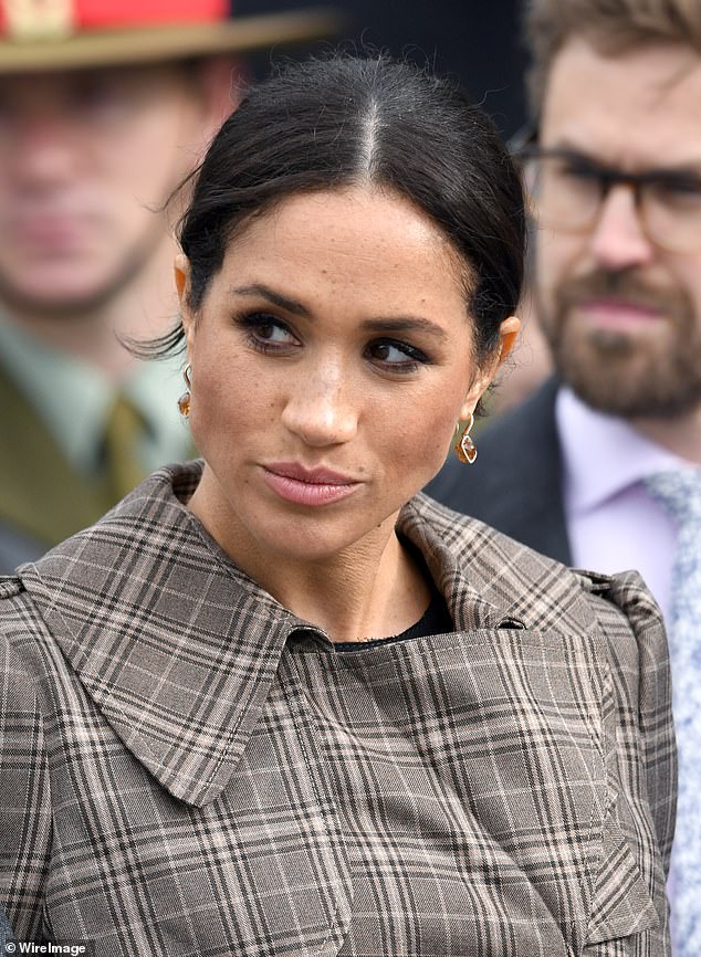 Meghan was reportedly giving orders to her hairdressers while at the same time someone was ironing the bottom of her dress during the tour