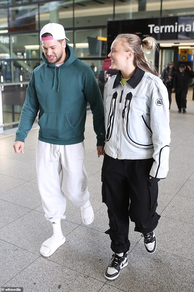 They held hands as they left the terminal building