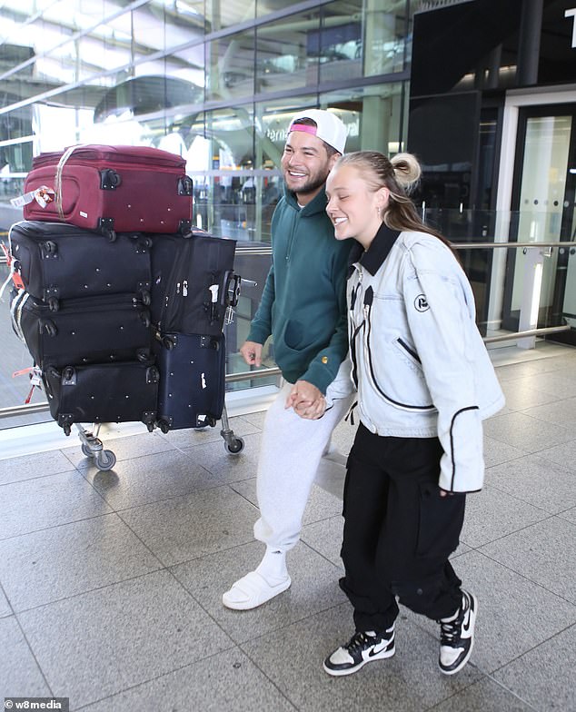 They packed on the PDA as they reunited in the airport