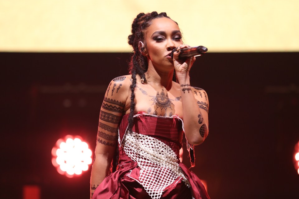 Leigh-Anne Pinnock performing on stage.