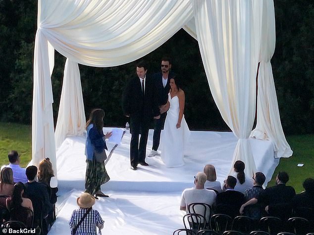 On Saturday, the pop star, 32, was a vision in bridal white as she walked down the aisle in a figure-hugging strapless gown with her husband-to-be, 34