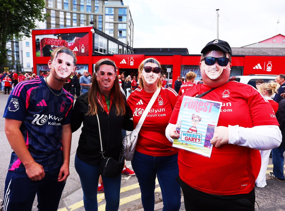 Nottingham Forest fans wearing Gary Neville masks.