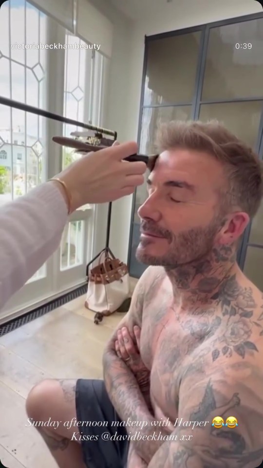 Harper Beckham applying makeup to David Beckham.