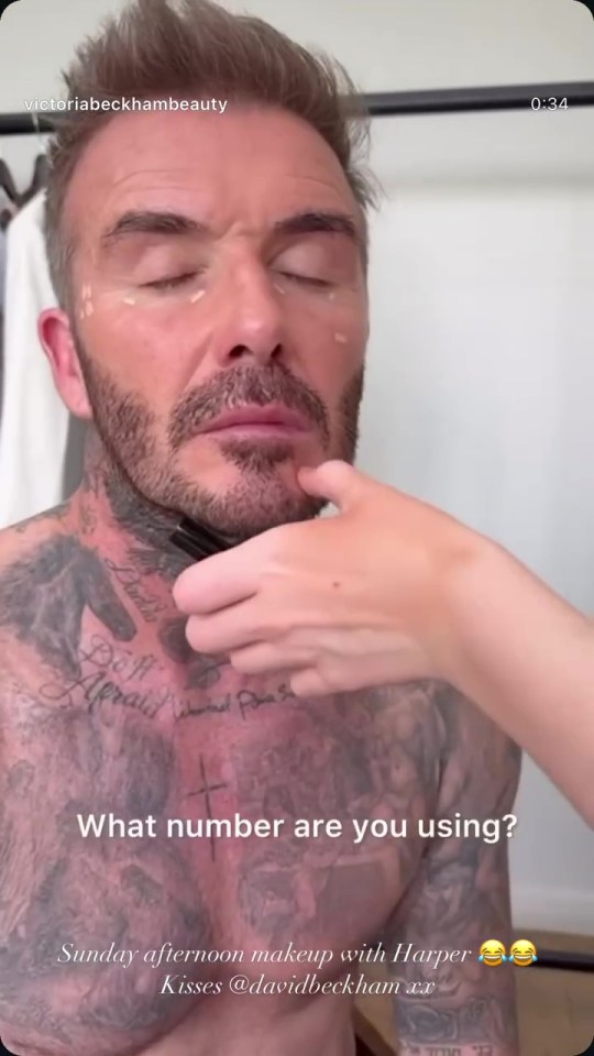 Harper Beckham applying makeup to David Beckham.
