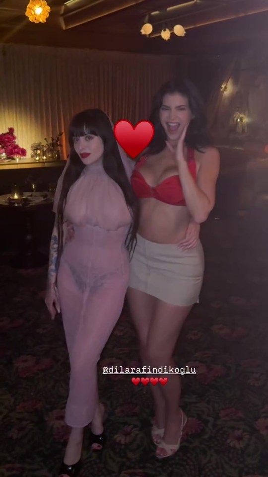 Two women posing together at an event.