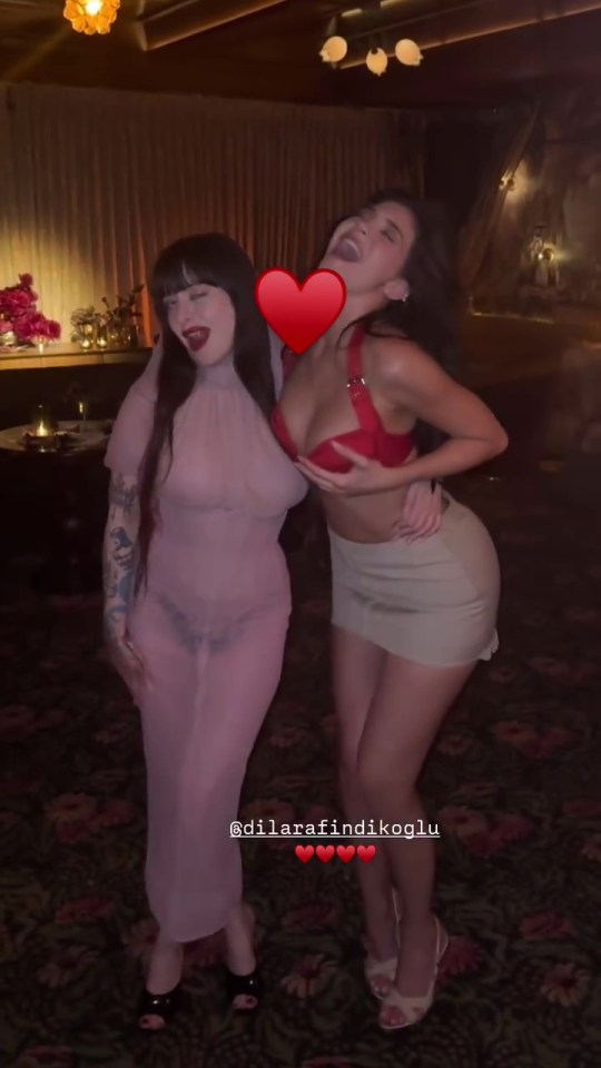 Two women posing together at an event.