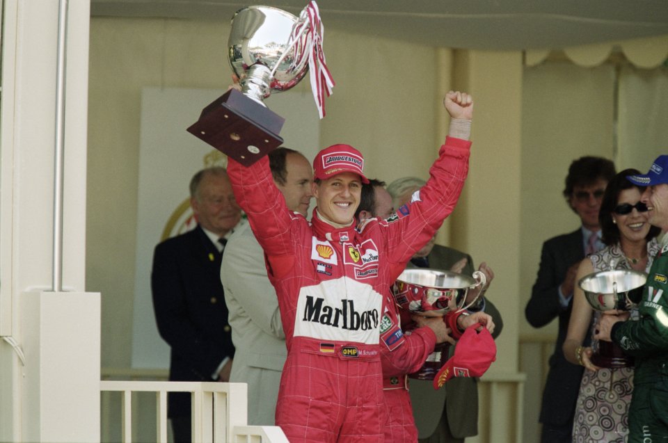 Michael Schumacher holding a trophy after winning the Monaco Formula One Grand Prix.
