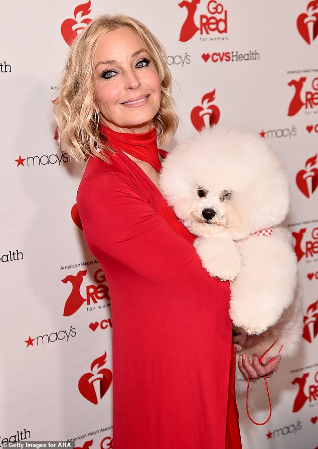 Bo (pictured with a pet in 2019) previously admitted that she sometimes considers anti-ageing procedures if she sees photographs of herself looking 'scary' - but simply reminds herself that Botox and plastic surgery can often change a person's facial expression for the worse