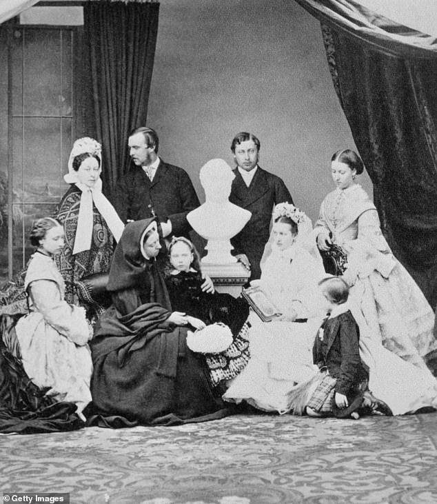 At one of her son's weddings, Victoria insisted her children pose around a bust of Albert. Pictured in 1863