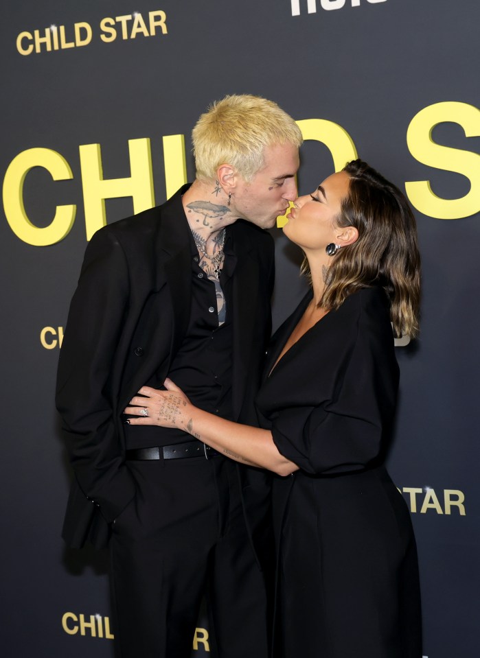 Jordan Lutes and Demi Lovato kissing at the premiere of Hulu's "Child Star."