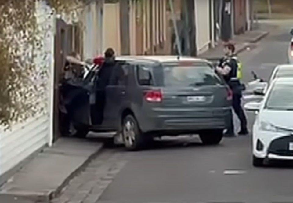 Police officer shooting a woman after a car accident.