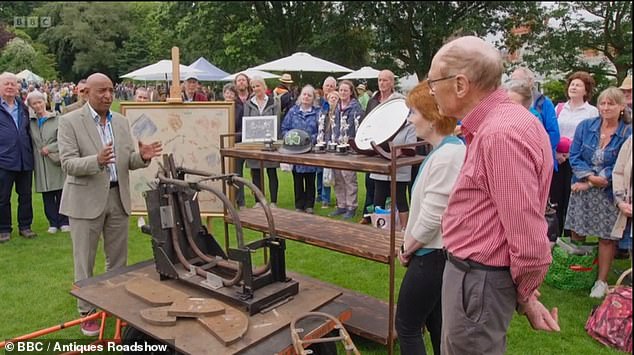 A pair of guests presented expert Raj Bisram (left) with an original jig which helped to build the Norton Manx, a famous motorbike designed by Rex McCandless back in 1949