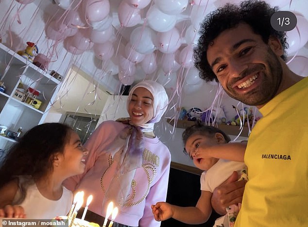 For Makka's birthday, the loving parents decorated one of their rooms full of pale pink balloons as they gathered around the cake to mark her special day