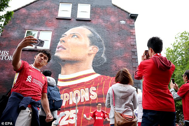 Supporters queued to take photos alongside Virgil van Dijk's mural just hours after he lifted the Premier League trophy