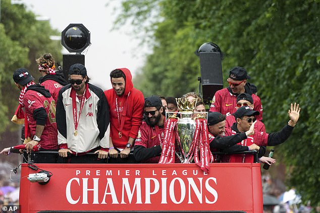 Players waved to supporters as music played and fans cheered those atop the bus