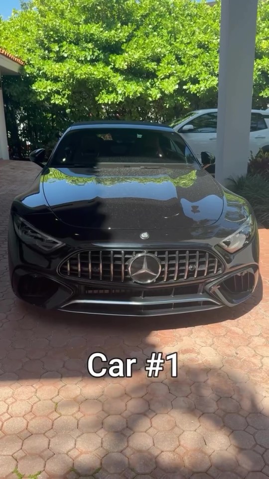 Black Mercedes-Benz parked in a driveway. Car #1.