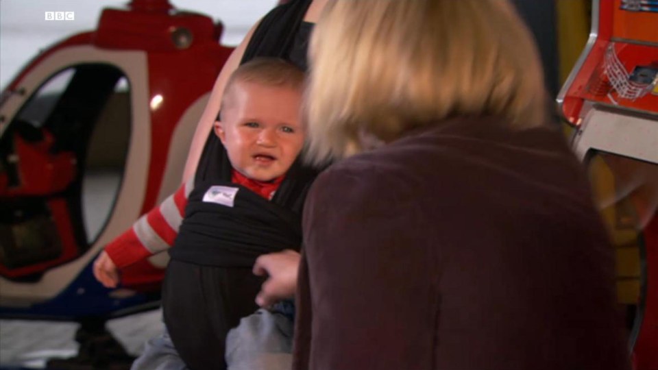 Still image from Gavin & Stacey: baby Neil in a baby carrier.
