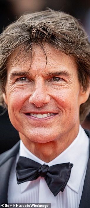 Tom Cruise's face has been the subject of speculation in recent years, with cosmetic experts suggesting he has used fillers and skin-tightening treatments to maintain his youthful looks (seen in 2022)