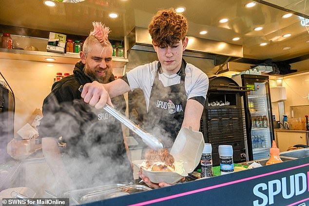 Spudman (left) also addressed claims that he had ended up in hot water for making his own gas-powered spud gun and firing it in Tamworth town centre, injuring a member of the public (Pictured with his son Dylan, right)
