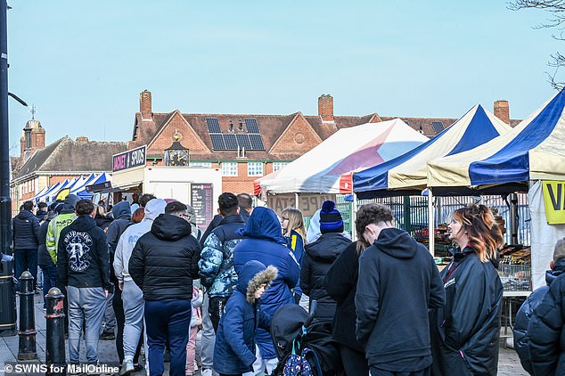 Ms Vaughan also moaned about Spudman¿s customers using her facilities without permission (Pictured: a queue of people waiting for 45 minutes in February for Spudman's stall)