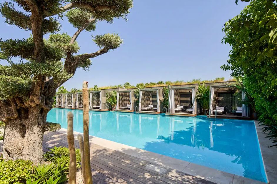 Luxury resort pool with private cabanas.