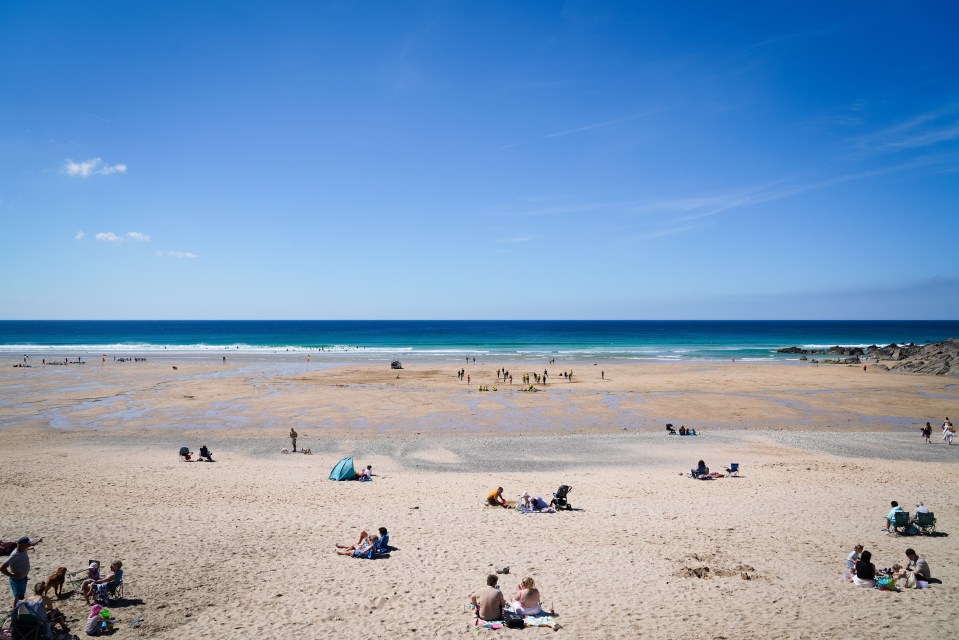 People relaxing on a sunny beach.