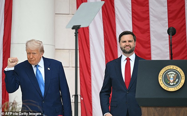 President Donald Trump (left) gives a fist bump alongside Vice President J.D. Vance (right) at Arlington National Cemetery on Monday