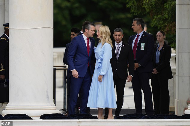 Secretary of Defense Pete Hegseth (left) and his wife Jennifer Rauchet (right) talk before Monday's Memorial Day ceremony at Arlington National Cemetery