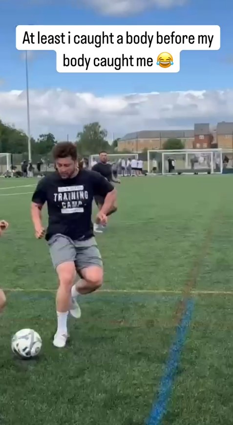 Man in a "Training Camp" shirt juggling a soccer ball.