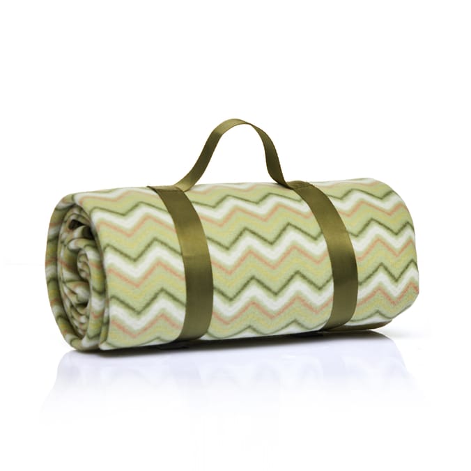 Rolled-up chevron patterned fleece blanket with carrying straps.