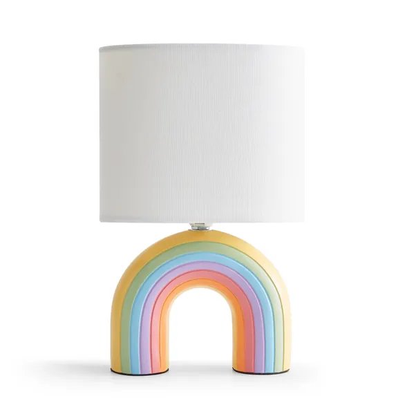 Rainbow table lamp with white shade.