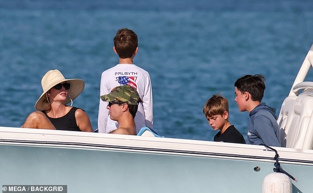 Later, she headed to the front of the boat to work on her tan with her husband Jared