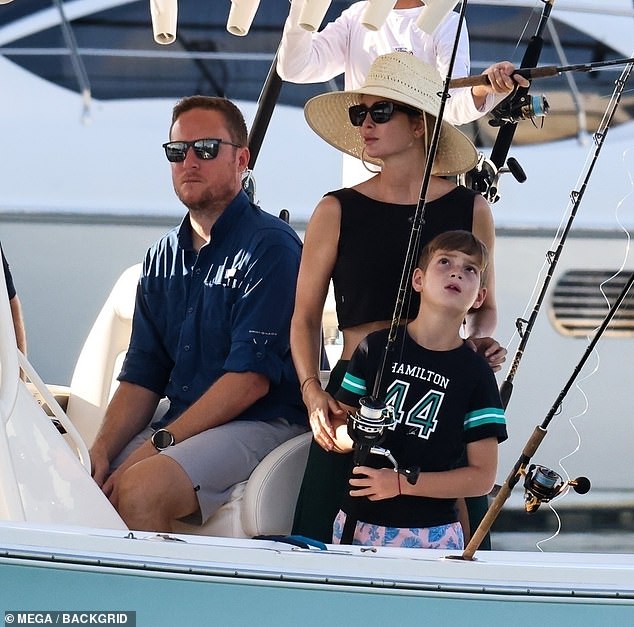 Theo, on the other hand, wore a pink swimsuit with blue leaves and a Lewis Hamilton jersey