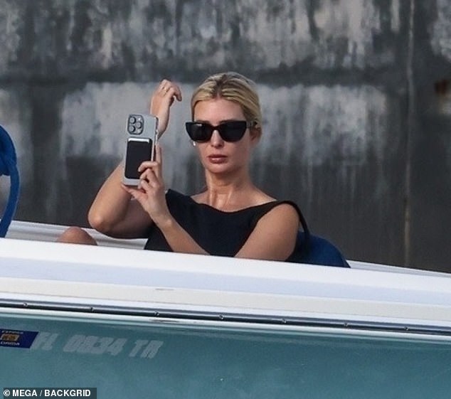 Ivanka was seen looking at herself in her phone camera and fixing her hair