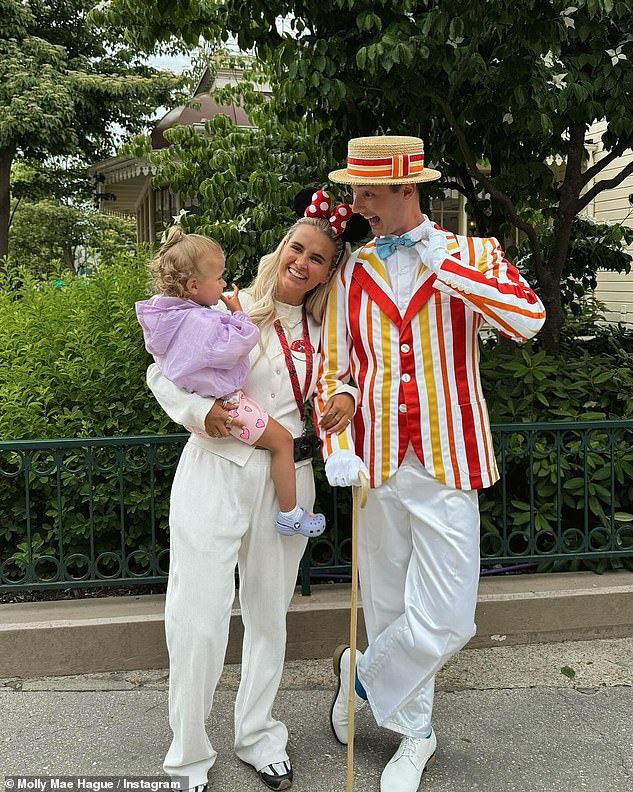 The mother and daughter beamed as they posed with the Disney characters