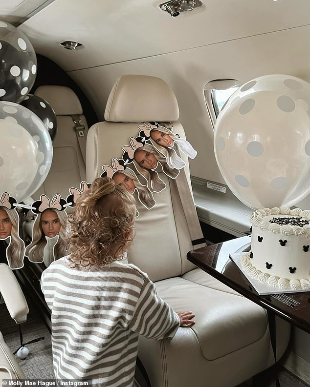 Molly also showed off the private jet they flew to Paris in which was personalised with white and black spotted balloons, a huge birthday cake and bunting with her face on