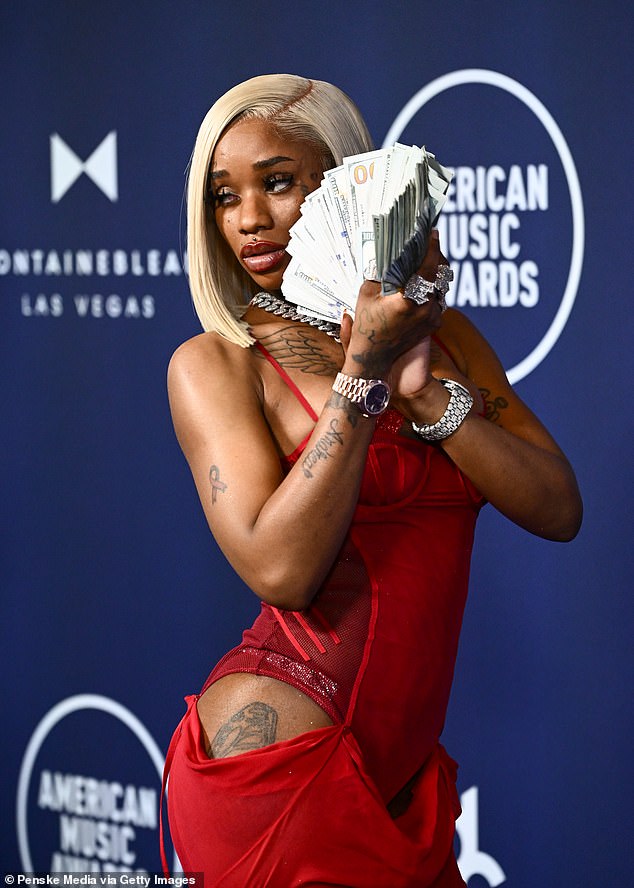 To make things even weirder, she carried stacks of money on the carpet