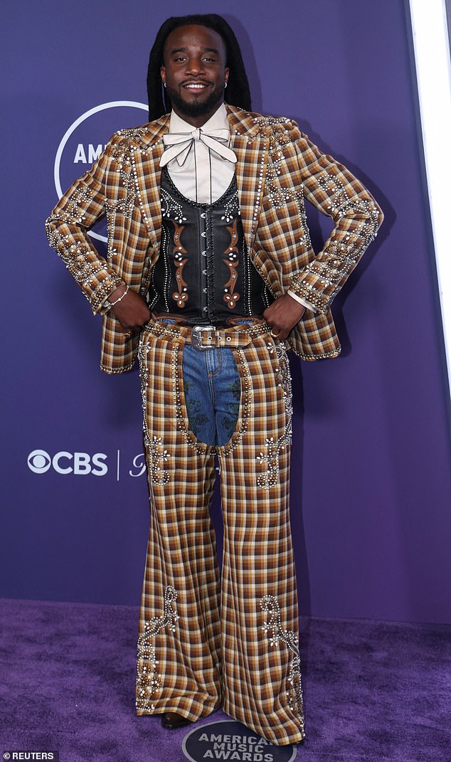 Shaboozey arrived in a set of plaid chaps and a matching jacket, which were decked out in gems. Underneath, he wore a patterned black vest and a bowtie, and boy, was it a lot