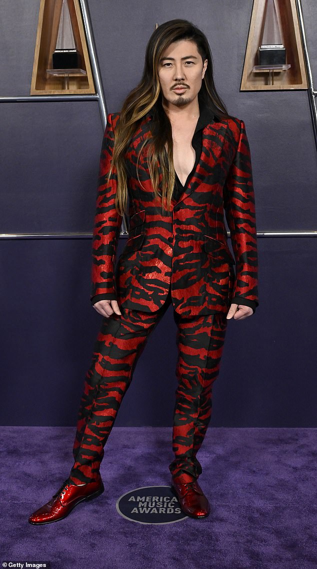 Musician Guy Tang ensured all eyes would be on him... but for the wrong reasons. He opted for an over-the-top red and black zebra striped suit