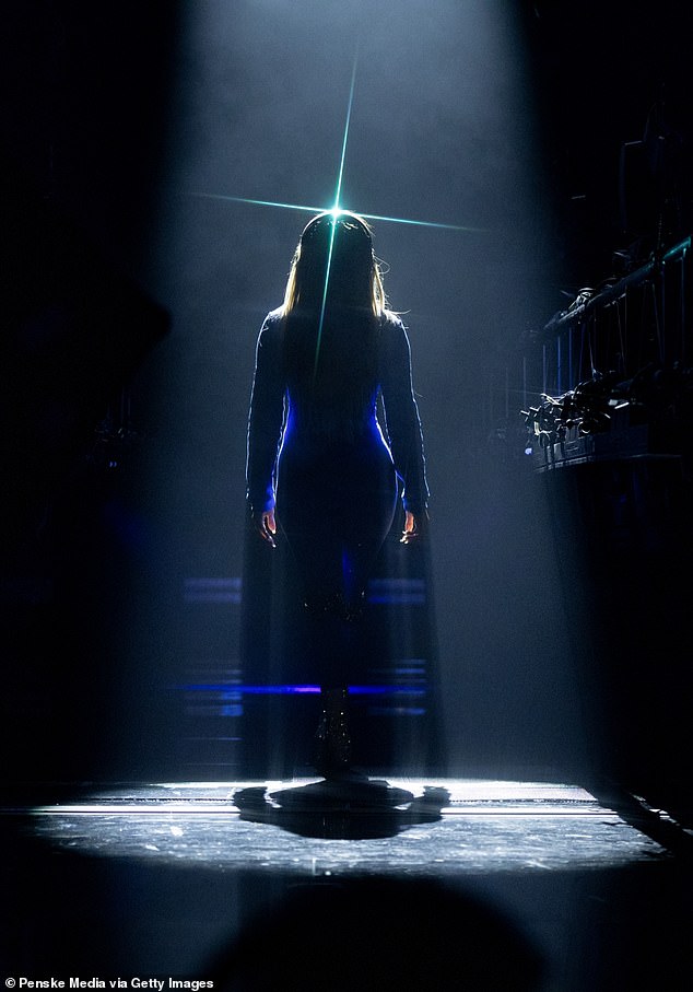 Lopez entered the stage with just her silhouette showing under a spotlight